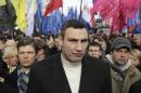 FILE - In this Tuesday, April 2, 2013 file photo Ukrainian lawmaker and chairman of the opposition party Udar (Punch), WBC heavyweight boxing champion Vitali Klitschko attends a rally in front of parliament building in Kiev, Ukraine. Towering over his fellow protest leaders, reigning world heavyweight boxing champion Vitali Klitschko has emerged as Ukraine's most popular opposition figure and has ambitions to become its next president. As massive anti-government protests continue to grip Ukraine, Wednesday Dec. 4, 2013, Klitschko is urging his countrymen to continue their fight to turn this ex-Soviet republic into a genuine Western democracy. (AP Photo/Sergei Chuzavkov, File)