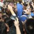Fans take photos of former NBA player McGrady as he arrives at Qingdao airport
