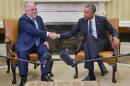 US President Barack Obama (R) shakes hands with Iraqi Prime Minister Haider al-Abadi during a bilateral meeting in the Oval Office on April 14, 2015 in Washington, DC