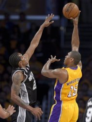 Los Angeles Lakers forward Metta World Peace, right, shoots over San Antonio Spurs forward Kawhi Leonard during the first half in Game 3 of a first-round NBA basketball playoff series, Friday, April 26, 2013, in Los Angeles. (AP Photo/Mark J. Terrill)