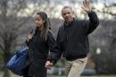 In this Jan. 4, 2015 file photo, President Barack Obama, with his daughter Malia Obama, waves as they arrive at the White House in Washington. President Barack Obama is missing out on a big part of his daughter's life: joining her college campus tours as she tries to figure out where to study in two years. Obama was absent when 16-year-old Malia toured Stanford University and the University of California at Berkeley last summer. Her mother, Michelle Obama, was the parent who accompanied Malia on recent visits to New York University, her father's alma mater Columbia University and Barnard College. (AP Photo/Manuel Balce Ceneta, File)