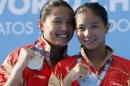 China's He poses with her gold medal next to her compatriot, silver medallist Wang, at the women's 3m springboard victory ceremony in Barcelona