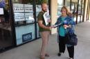 In this photo taken Aug. 19, 2016, Iraq war veteran and Nevada Republican party staffer Jon Staab talks with Vicky Maltman, a Reno veterans rights activist, before going out to canvass veterans, in Reno, Nev. Two years ago, the Republican National Committee hatched a plan to bolster the turnout of one of the most conservative-leaning groups in the nation. The party calculated that 6.5 million veterans either didn't register to vote or didn't cast a ballot in the 2012 election. (AP Photo/Nicholas Riccardi)