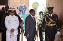 Zimbabwe's President Robert Mugabe arrives to bid farewell to South African former president Nelson Mandela lying in state at the Union Buildings in Pretoria on December 11, 2013