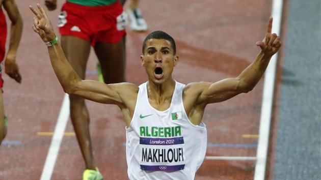 Algeria's Taoufik Makhloufi celebrates as he wins the men's 1500m final during the London 2012 Olympic Games at the Olympic Stadium
