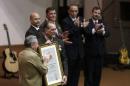 Cuba's President Raul Castro stands next to Rene Gonzalez, one of the so-called "Cuban Five" during a ceremony in Havana