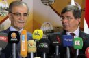 Turkish FM Ahmet Davutoglu (right) and Kirkuk governor Najm al-Din Omar Karim held a joint press conference on August 2