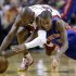 Detroit Pistons guard Kim English, right, and Miami Heat guard Ray Allen dive for a loose ball during the second half of an NBA basketball game, Friday, Jan. 25, 2013, in Miami. The Heat defeated the Pistons 110-88. (AP Photo/Wilfredo Lee)