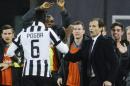 Juventus' Paul Pogba celebrates with coach Massimiliano Allegri after scoring a Serie A soccer match between Napoli and Juventus, at the San Paolo stadium in Naples, Italy, Sunday, Jan. 11, 2015. (AP Photo/Salvatore Laporta)