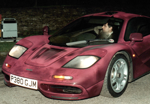 Photo dated Nov. 15 1998 of comedian Rowan Atkinson at the wheel of his McLaren F1 sports car. It was reported Friday Feb. 8 2013 that it took more than a year — and more than 900,000 pounds ($1,400,000) — to get his supercar up and running after a 2011 crash in which he badly injured a shoulder, but F1's now sell for around 3.5 million pounds. The car makes extensive use of carbon fiber and needed specialist care. The car insurance settlement is one of the largest in British history. (AP Photo/Barry Batchelor/PA) UNITED KINGDOM OUT NO SALES NO ARCHIVE