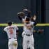 Baltimore Orioles' Nate McLouth (9), Nick Markakis (21) and Adam Jones celebrate after the Orioles defeated the Houston Astros in a baseball game Tuesday, June 4, 2013, in Houston. The Orioles won 4-1. (AP Photo/David J. Phillip)