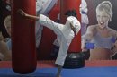 Sweety, 22, a student, takes a self defence class in New Delhi