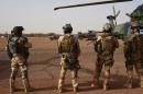 French soldiers stand guard on January 2, 2015 at a military base outside the northern Malian city of Gao