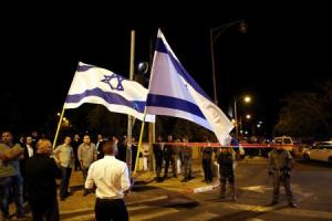 Israelis wave national flags next to security personnel&nbsp;&hellip;