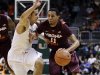 Miami's Shane Larkin (0) tries to steal the ball from Virginia Tech's Erick Green (11) during the first half of an NCAA college basketball game in Coral Gables, Fla., Wednesday, Feb. 27, 2013. (AP Photo/J Pat Carter)