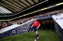 England's new rugby union captain Dylan Hartley is introduced to the crowd as he walks out of the tunnel to begin a public team training session at Twickenham Stadium, south west of London on January 29, 2016