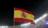 A fan waves a Spain flag before the start of the 2010 World Cup final soccer match at Soccer City stadium