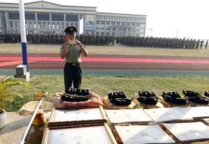 A Chinese army advisor uses mobile phone to take pictures …