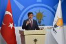 Turkey's Prime Minister Davutoglu speaks during a news conference at his ruling AK Party headquarters in Ankara, Turkey