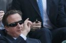 Britain's Prime Minister, David Cameron sits on Centre Court for the men's singles final tennis match between Andy Murray of Britain and Novak Djokovic of Serbia at the Wimbledon Tennis Championships, in London