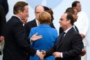 French President Francois Hollande (R), pictured with British Prime Minister David Cameron on November 30, 2015, congratulated Cameron on winning a recent vote in the British parliament to start bombing IS targets in Syria