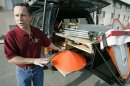 FILE - In this May 26, 2006, file photo Tornado chaser Tim Samaras shows the probes he uses when trying to collect data in Ames, Iowa. Jim Samaras said Sunday, June 2, 2013, that his brother Tim Samaras was killed along with Tim's son, Paul Samaras, and another chaser, Carl Young, on Friday, May 31, 2013 in Oklahoma City. The National Weather Service's Storm Prediction Center in Norman, Okla., said the men were involved in tornado research. (AP Photo/Charlie Neibergall, File)