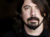 FILE - In this Jan. 31, 2012 file photo, musician Dave Grohl poses for a portrait in Los Angeles. The often eloquent Foo Fighters frontman has signed on to give the keynote speech at the 2013 South By Southwest Music Conference on March 14 in Austin, Texas. He's also working on his Sound City documentary and new Queens Of The Stone Age material with Josh Homme. Both are expected to be early released early next year. (AP Photo/Matt Sayles, file)