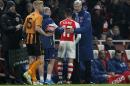 Arsenal's French manager Arsene Wenger (R) gestures to Chilean striker Alexis Sanchez after he is substituted during the match between Arsenal and Hull City at the Emirates Stadium in London on January 4, 2015