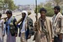 Shiite fighters known as Houthi gather at a street in Aden, Yemen, Thursday, April 2, 2016. Yemen's Shiite rebels and their allies fought their way through the commercial center of Aden on Thursday and seized the presidential palace on a strategic hilltop in this southern coastal city, security officials said. (AP Photo/Wael Qubady)