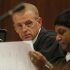State prosecutor Gerrie Nel, prepares for a hearing in the Pretoria, South Africa high court, Thursday, March 28, 2013. The state is opposing the relaxation of bail conditions in the charges against athlete Pistorius who is charged with the shooting death of his girlfriend Reeva Steenkamp last month. (AP Photo/Denis Farrell)