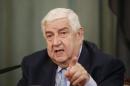 Syrian Foreign Minister Walid al-Muallem attends a news conference in Moscow
