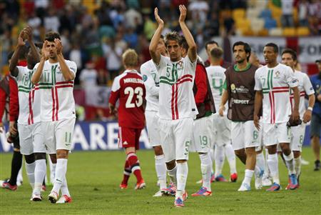 Portugal's players celebrate at the end of their Group B Euro 2012 soccer match against Denmark in Lviv