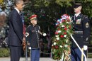 President Barack Obama presents a wreath at the Tomb of the Unknowns at Arlington National Cemetery during a Veterans Day ceremony in Arlington, Va., Sunday, Nov. 11, 2012. (AP Photo/J. Scott Applewhite)