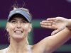 Maria Sharapova of Russia reacts after defeating Samantha Stosur of Australia during their women's quarter-final match at the Qatar Open tennis tournament in Doha