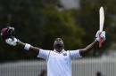 West Indies' Darren Bravo celebrates after scoring a century against Australia during their cricket test match in Hobart, Australia, Saturday, Dec. 12, 2015. (AP Photo/Andy Brownbill)