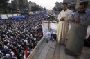 Members of the Muslim Brotherhood and supporters of deposed Egyptian President Mohamed Mursi perform evening prayers at the Rabaa Adawiya square