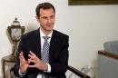 Syria's President Bashar al-Assad speaks during an interview with Spanish newspaper El Pais in Damascus