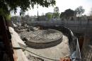A temple dedicated to the god of wind Ehecatl-Quetzalcoatl lays unearthed at the construction site of a shopping center in Mexico City, Wednesday, Nov. 30, 2016. Archeologists from Mexico's National Anthropology and History Institute say this structure where eight sets of human remains were found is worth preserving and will eventually be made accessible to the public. (AP Photo/Eduardo Verdugo)