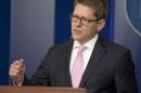 In this March 10, 2014, photo, White House press secretary Jay Carney answers questions during his daily news briefing at the White House as he spoke about the situation in Ukraine. In a diplomatic dig at Russia, President Barack Obama is hosting the new Ukrainian prime minister at the White House on March 12, a high-profile gesture aimed at cementing the West's allegiance to Ukraine's fledgling government. The meeting between Obama and Prime Minister Arseniy Yatsenyuk comes as a pro-Russian area of Ukraine readies for a referendum Sunday to determine its future. (AP Photo/Pablo Martinez Monsivais)