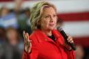 Superdelegates help Clinton expand her lead despite NH loss