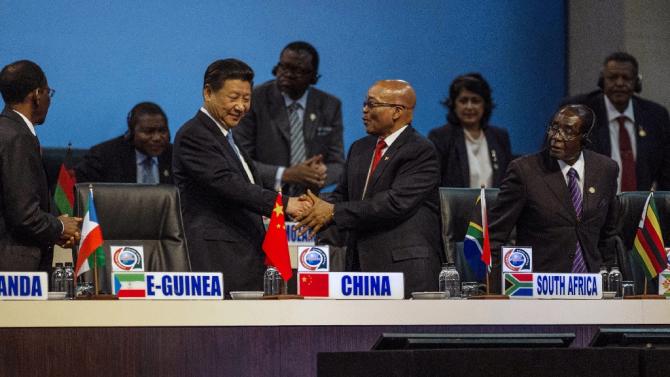 Chinese President Xi Jinping (L) shakes hands with South African President Jacob Zuma at the Forum on Africa and China Cooperation on December 4, 2015
