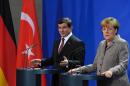 German Chancellor Angela Merkel (R) and Turkish Prime Minister Ahmet Davutoglu at a press conference in January