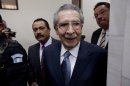 Guatemala's former dictator Efrain Rios Montt (1982-1983) leaves the courtroom after his pre-trial hearing in Guatemala City, Thursday, Jan. 24, 2013. A judge in Guatemala has begun pre-trial hearings in a genocide case against former dictator Efrain Rios Montt, who is accused of overseeing hundreds of killings when he ruled Guatemala from 1982 to 1983, at the height of the country's 36-year civil war. The war ended in peace accords in 1996, after 200,000 deaths. (AP Photo/Moises Castillo)