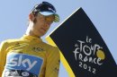 Bradley Wiggins, winner of the 2012 Tour de France cycling race, looks back on the podium in Paris, France, Sunday July 22, 2012. (AP Photo/Laurent Cipriani)