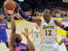 Los Angeles Lakers center Dwight Howard, right, blocks the shot of Detroit Pistons guard Brandon Knight during the first half of their NBA basketball game, Sunday, Nov. 4, 2012, in Los Angeles.  (AP Photo/Mark J. Terrill)