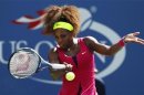 Williams of the U.S. hits a return to Makarova of Russia during their women's singles match at the U.S. Open tennis tournament in New York