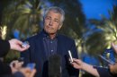 U.S. Secretary of Defense Chuck Hagel speaks with reporters after reading a statement on chemical weapon use in Syria during a press conference in Abu Dhabi, United Arab Emirates on Thursday, April 25, 2013. (AP Photo/Jim Watson, Pool)