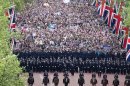 Police form a line as crowds watch Queen Elizabeth and the Royal family from the Mall during the Diamond Jubilee celebrations in London