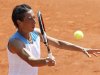 Schiavone of Italy returns the ball to Date-Krumm of Japan during the French Open tennis tournament at the Roland Garros stadium in Paris