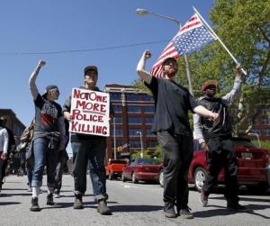Protesters walk outside the Justice Center following&nbsp;&hellip;
